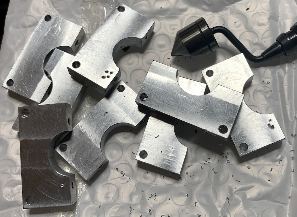 Collection of clamp blocks, all holes and edges deburred...